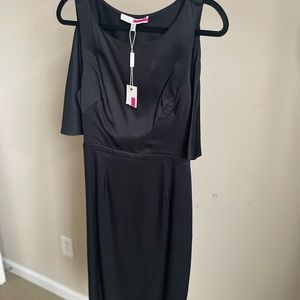 Black dress with back cape and back-out! Cute knee length dress for parties.
